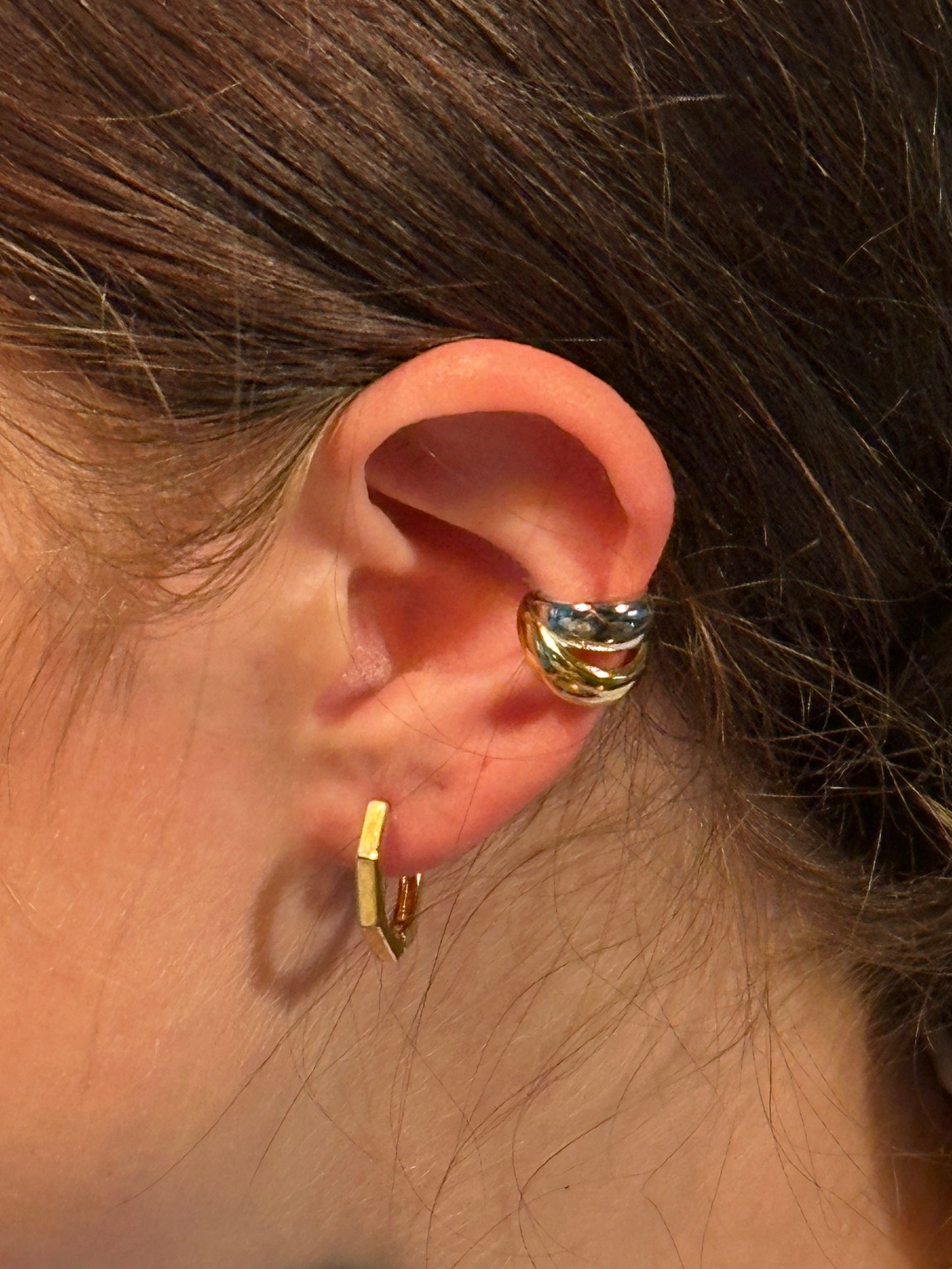 The Elara Geometric Clicker Hoop Earrings, modeled
