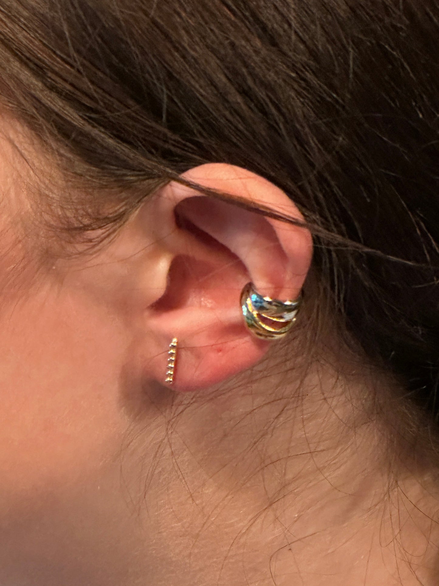 The Noemi Beaded Bar Stud Earring, modeled vertically