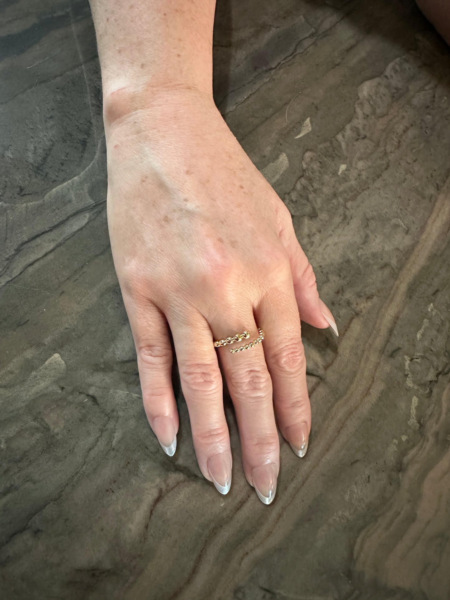 The Noemi Beaded Spiral Ring, modeled