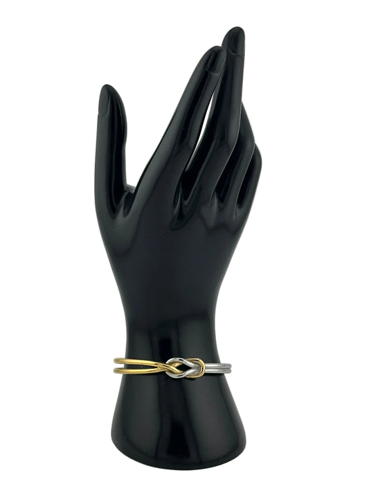 two tone bracelet shown on black hand mannequin display