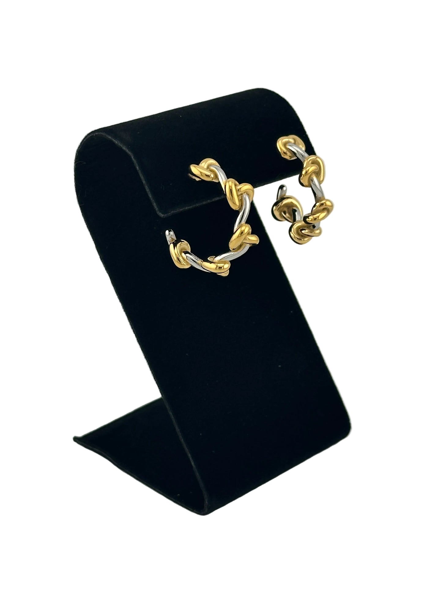two tone hoop earrings shown on black velvet display