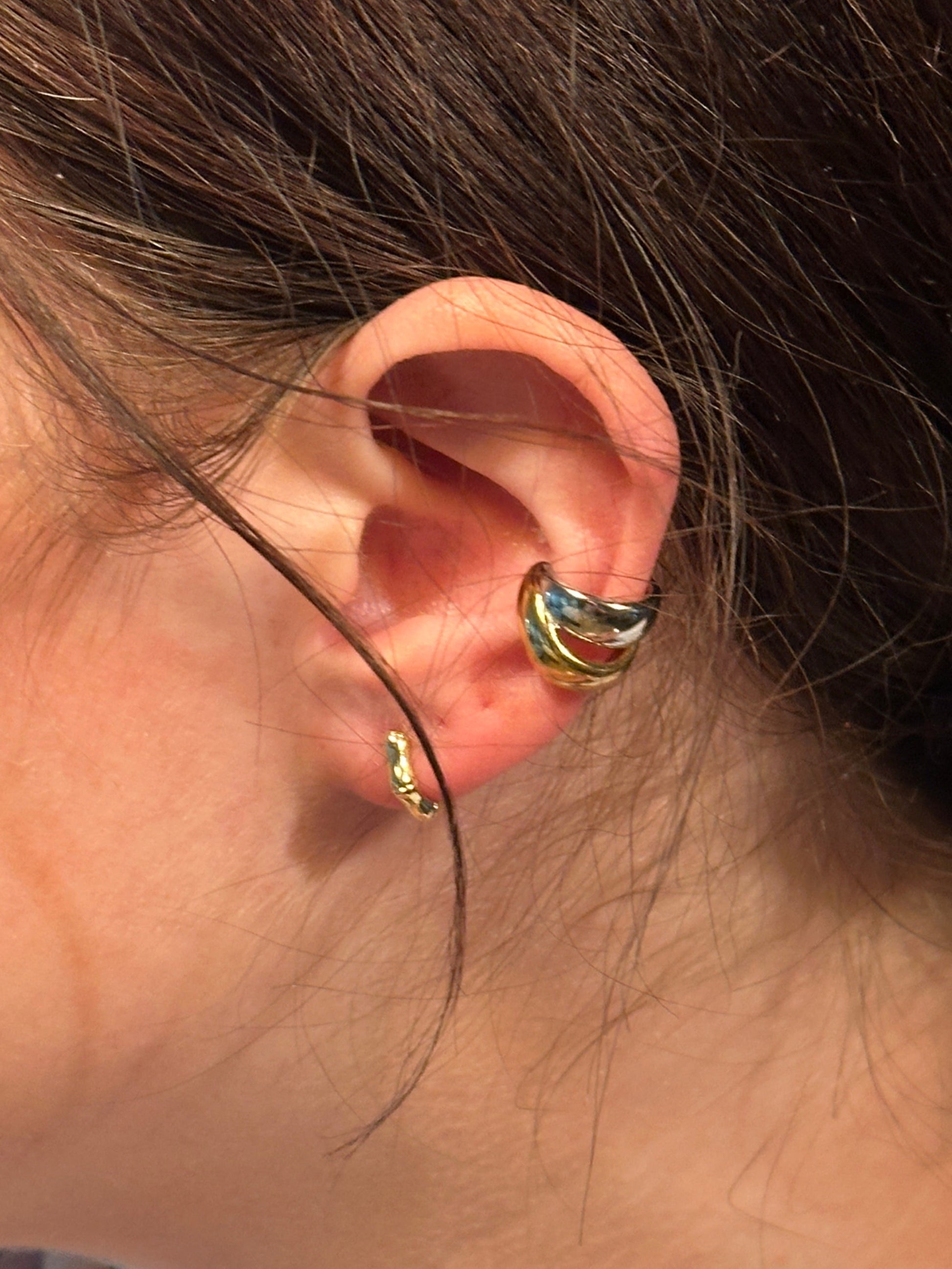 The Berneda Bamboo Clicker Hoop Earrings, modeled