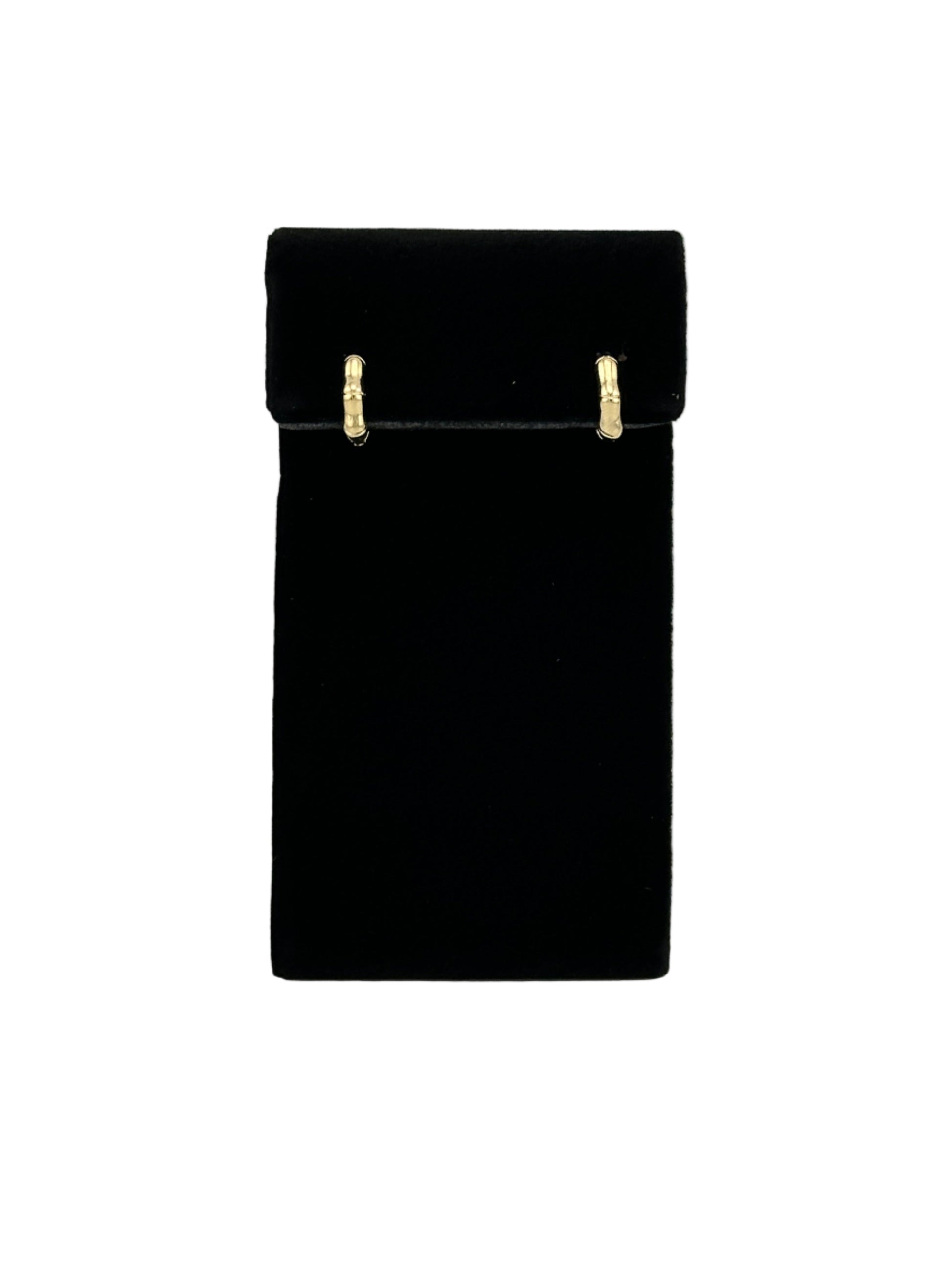 The Berneda Bamboo Clicker Huggie Earrings on black velvet earring stand and white background