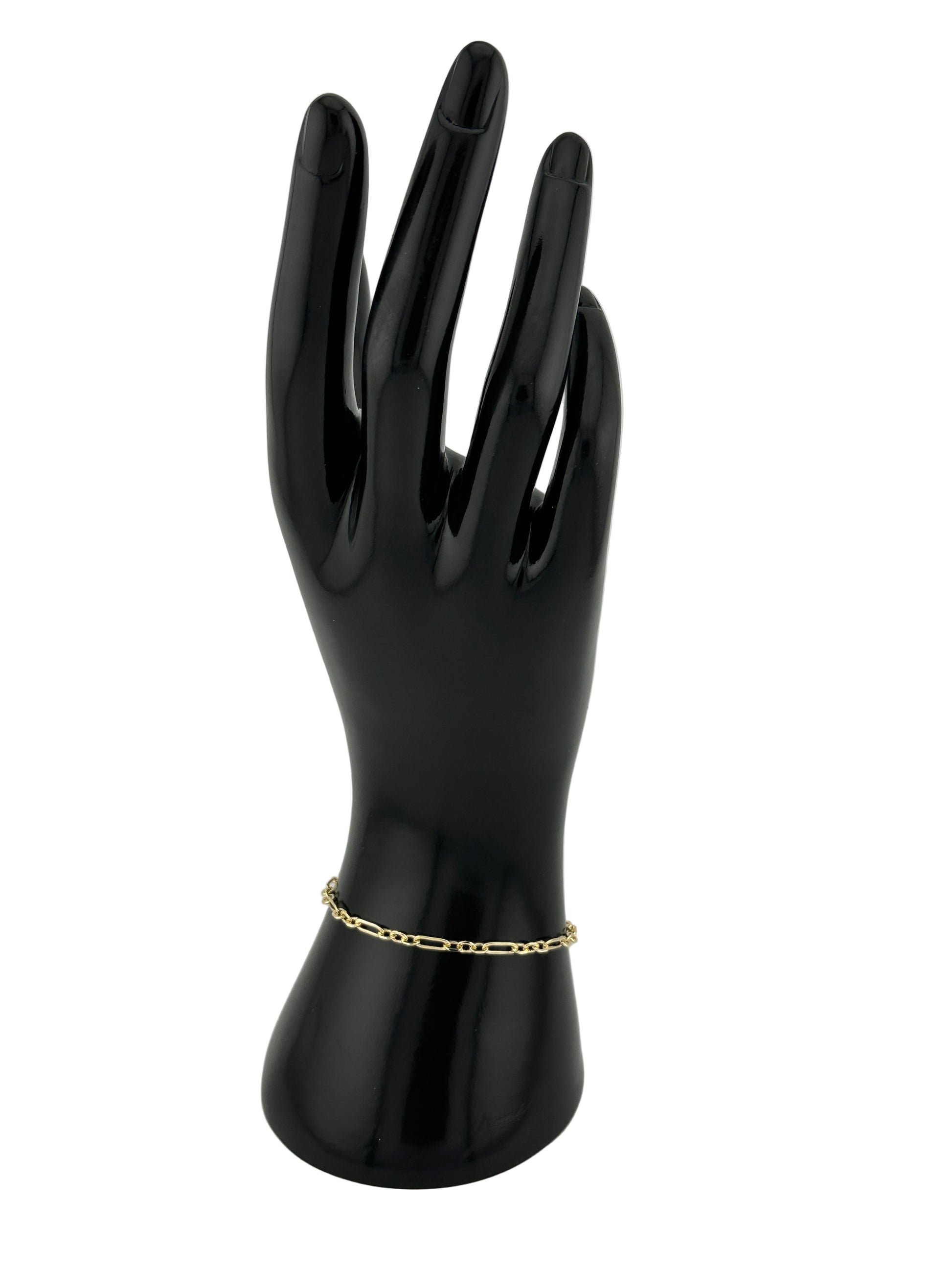 The Catena Bracelet, shown on black hand model and white background