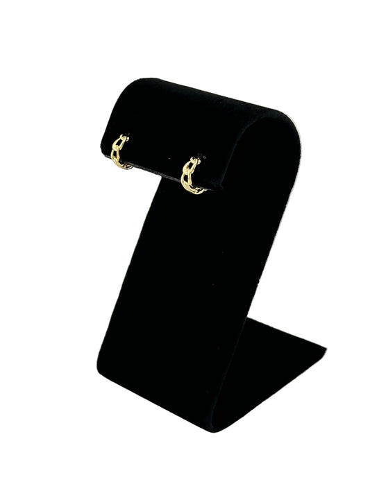 The Cora Cuban Chain Huggie Hoop Earring, side view on black velvet earring stand and white background