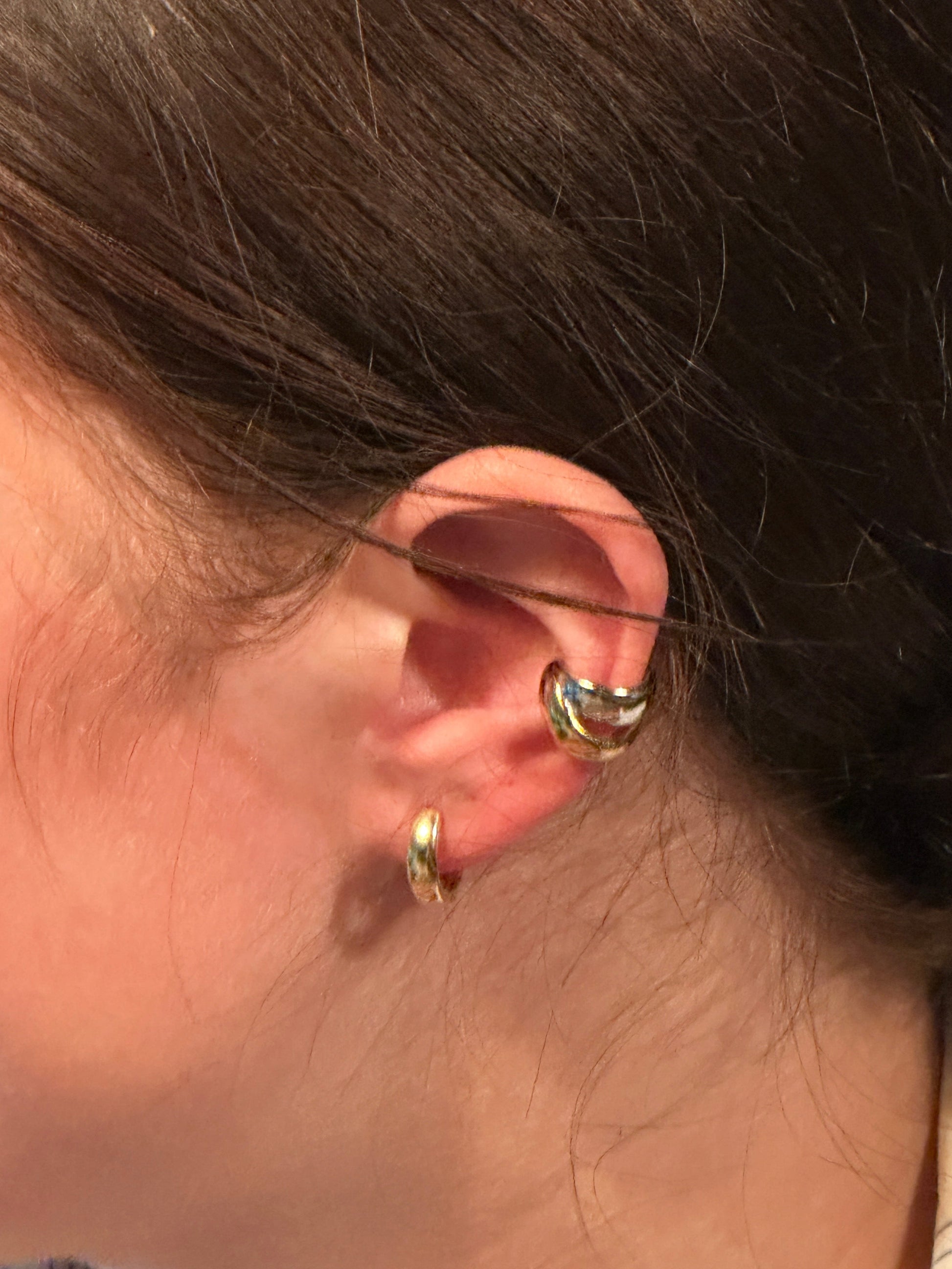 The Dani Clicker Hoop Earrings, modeled