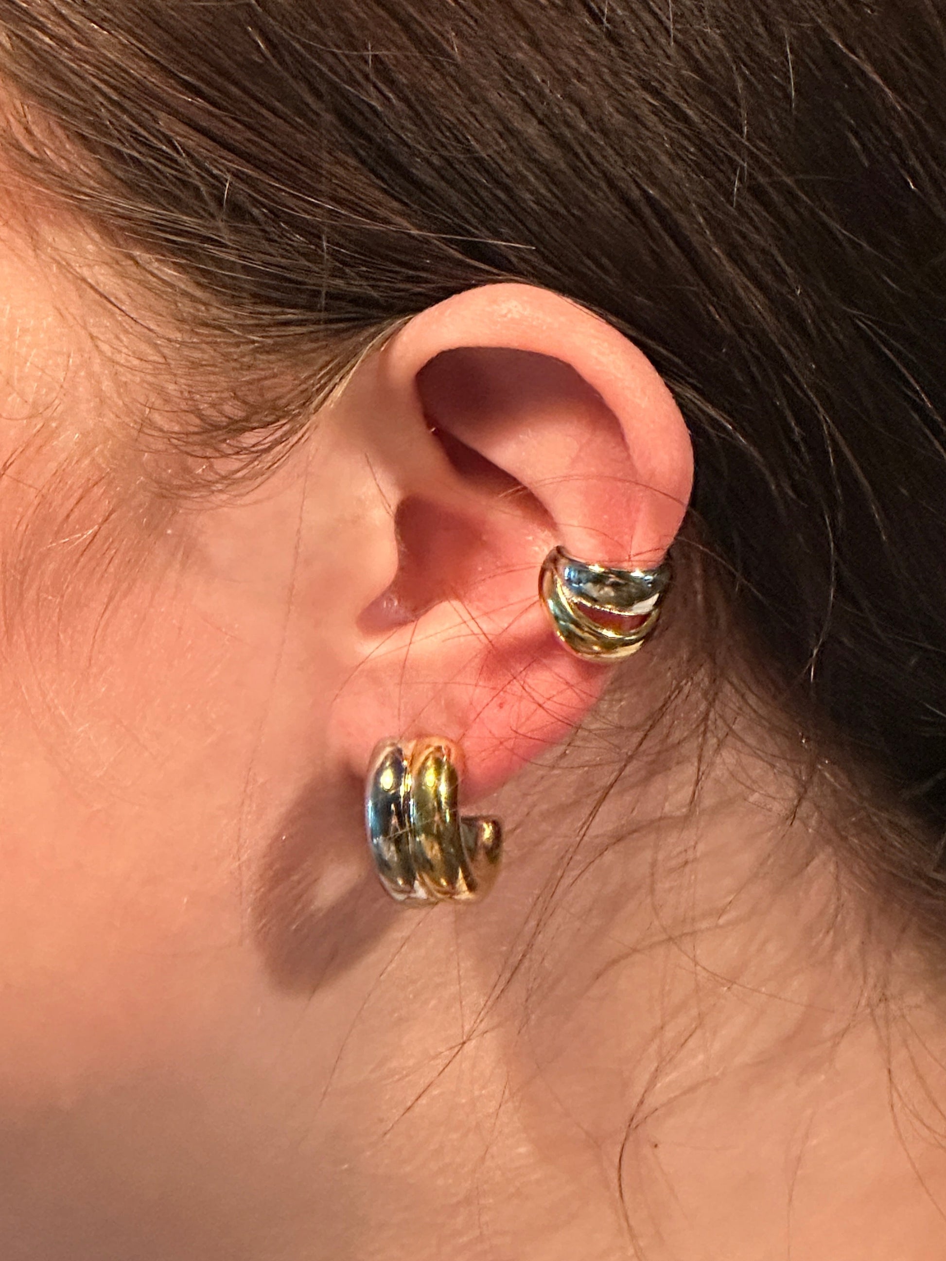 The Duetto Interlink Earrings, modeled