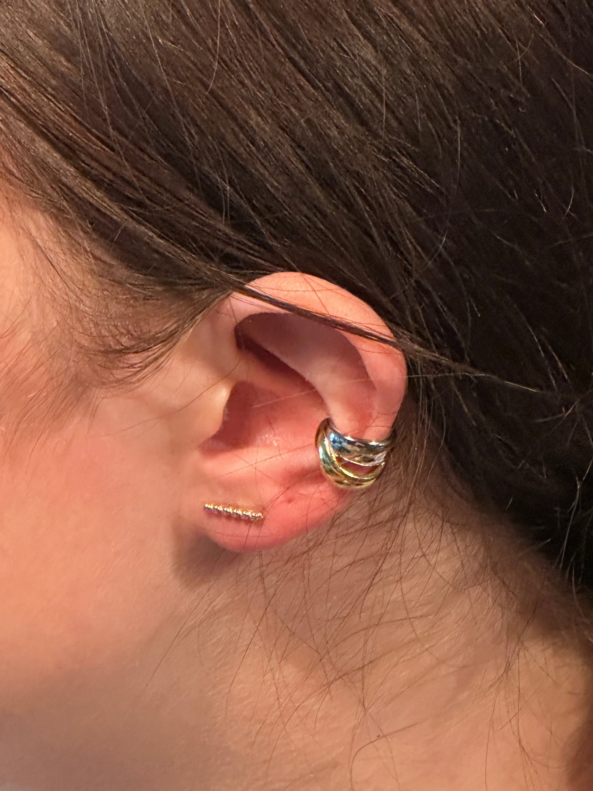 The Noemi Beaded Bar Stud Earring, modeled horizontally