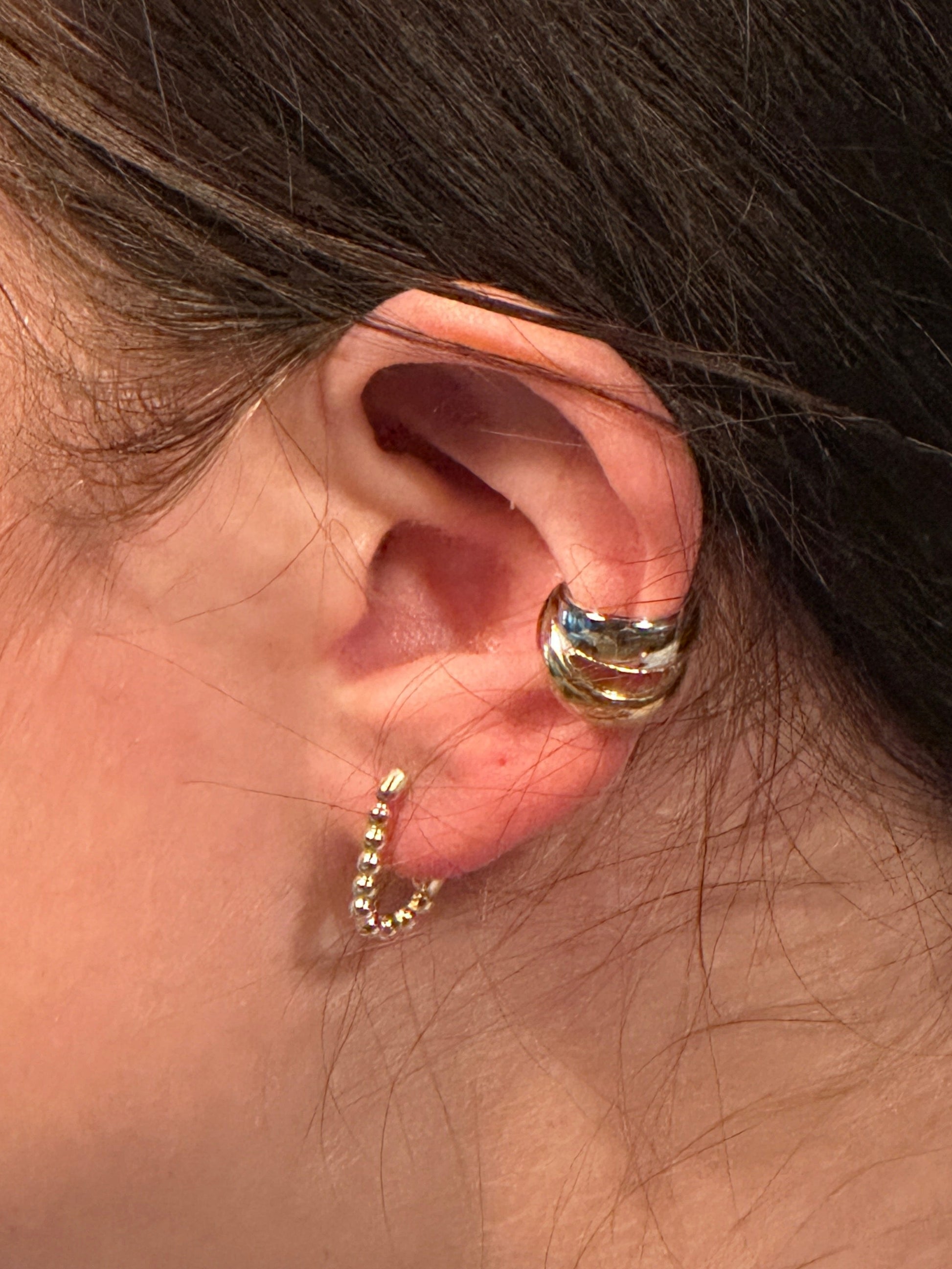 The Noemi Beaded Rectangle Clicker Hoop Earrings, modeled