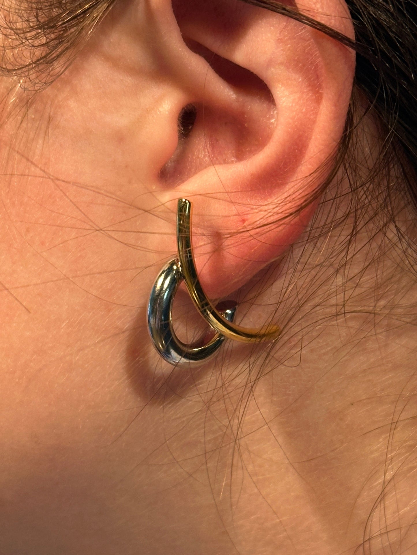 The Orbitale Interlock Earring, modeled