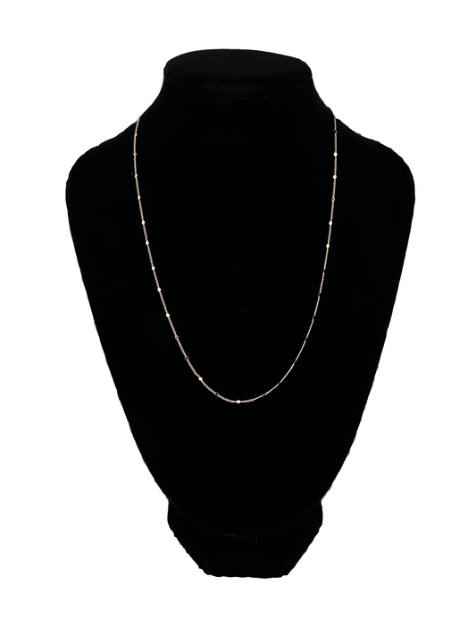 The Stella Dainty Sparkle Chain 16 in on black velvet neck display and white background