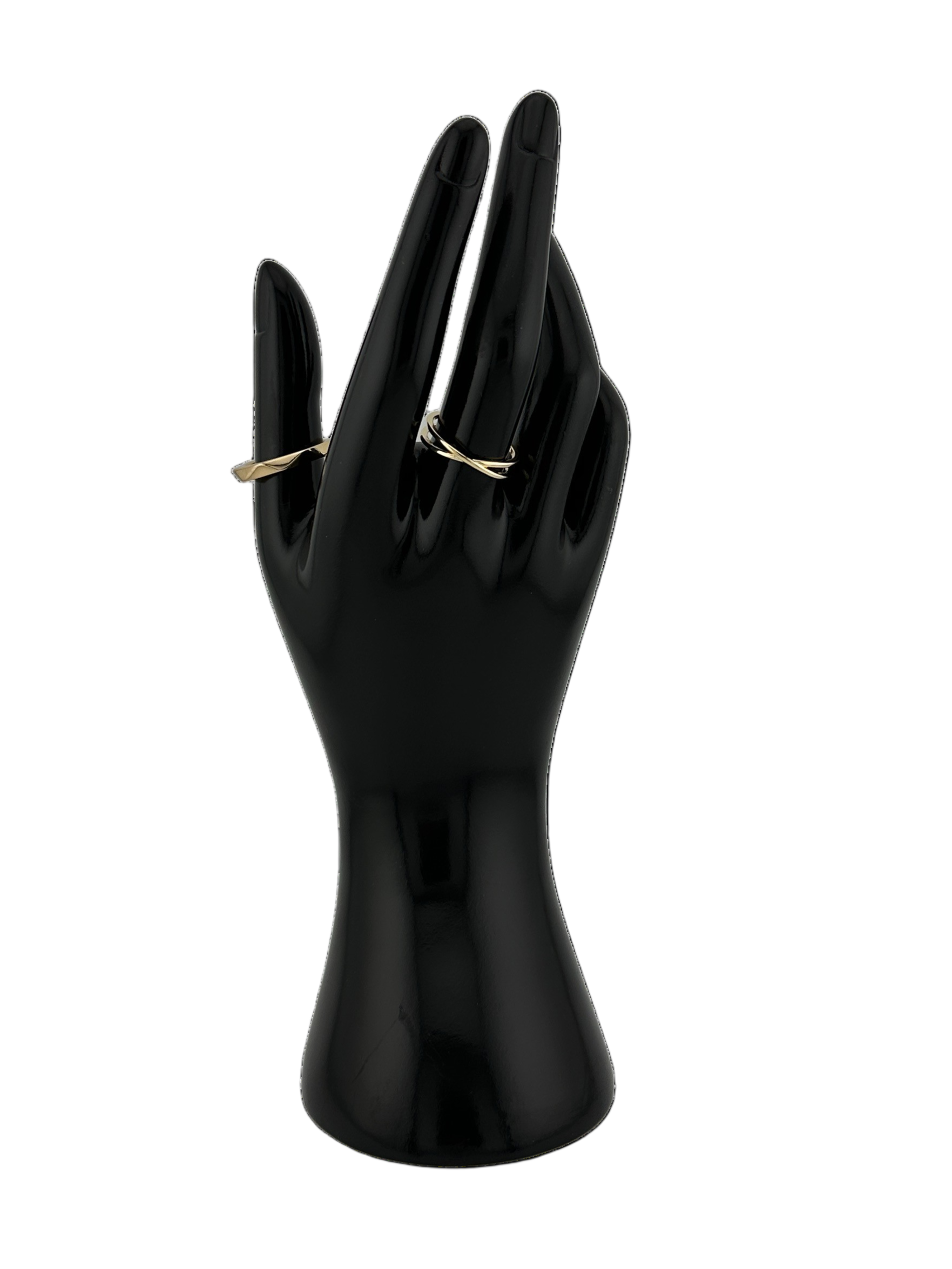 The Xenia X Ring and The Elara Faceted Band Ring on black mannequin hand on white background